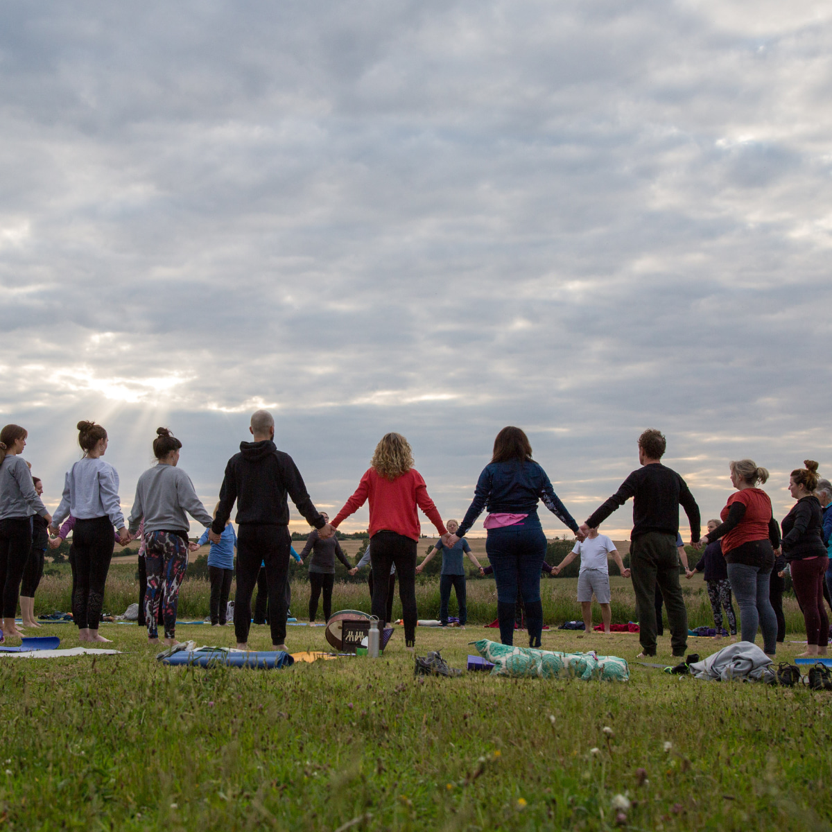 Group of people enjoying mindfulness practices outside in nature